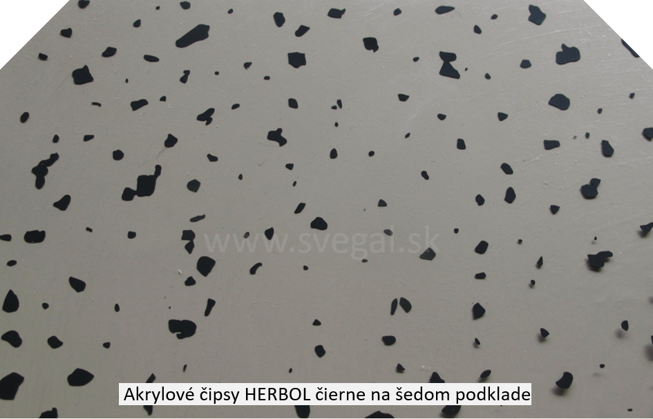 Akrylové čipsy Herbol čierne na šedom podklade. Úprava estetiky podláh. Možno použiť aj na povrch akrylátových náterov.